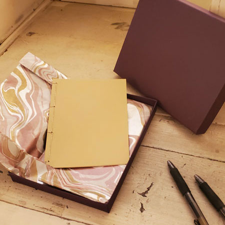 A Bespoke Book by Jason Stoneking, shown in its box and wrapping