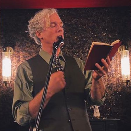 Jason Stoneking on stage at Ivy Writers Paris, photographed by Carrie Chappell