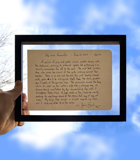 A framed Sky                                                                                 Sketch by Jason Stoneking, held aloft against a blue sky