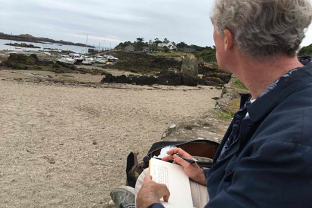 Jason Stoneking writing a sketch of the sky over Chausey